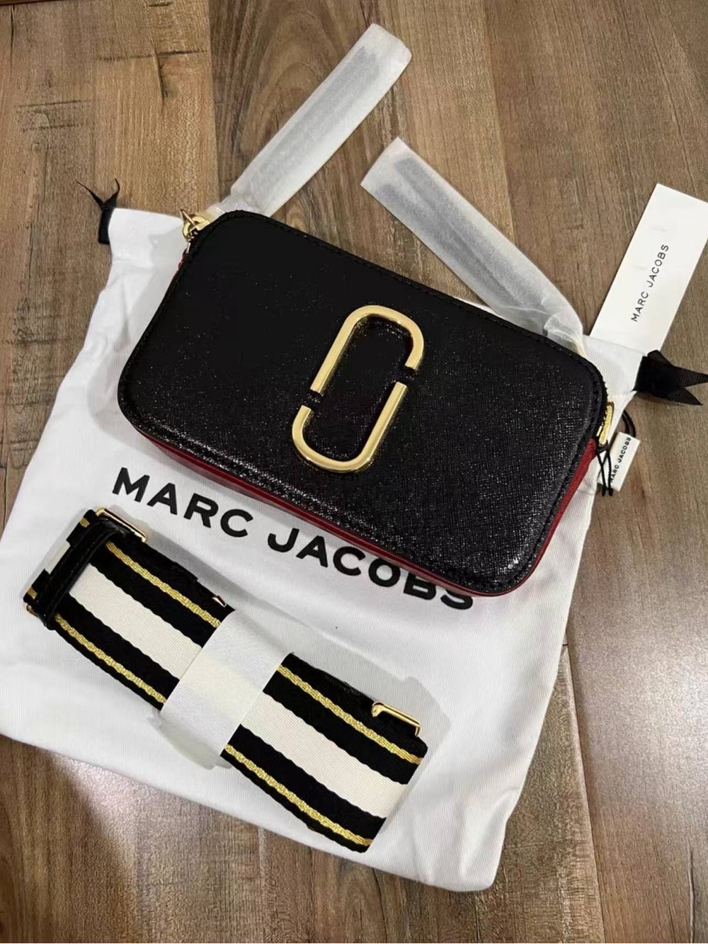 Marc Jacobs Black Crossbody Camera Bag with Gold Hardware and Striped Strap